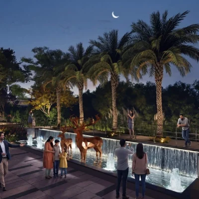 CKPC Heart of Harmony, Kudlu Gate Water feature in a palm-lined plaza at night at CKPC Heart of Harmony, developer render